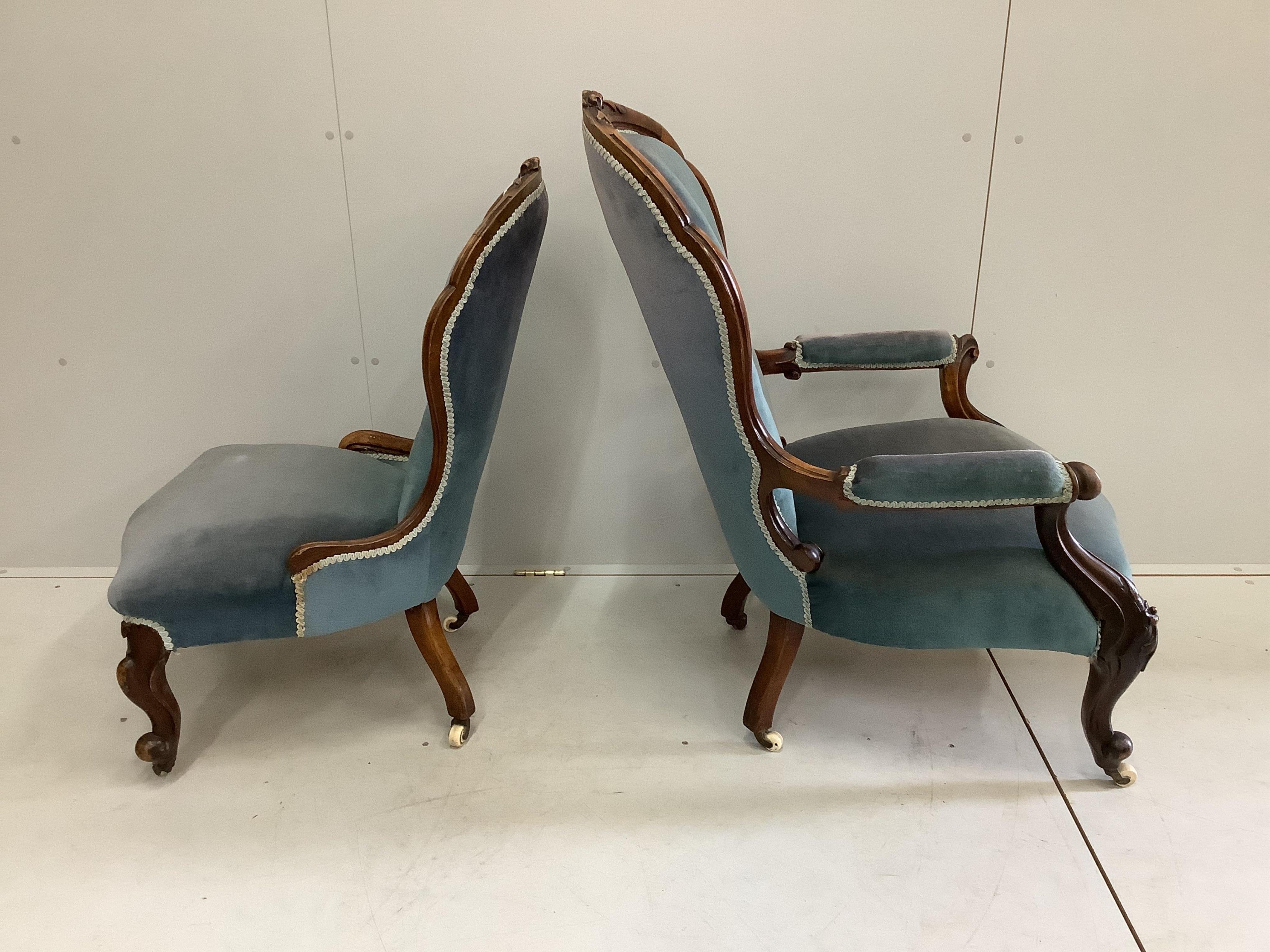 A near pair of Victorian walnut spoon back chairs, one with arms, larger width 65cm, depth 75cm, height 102cm